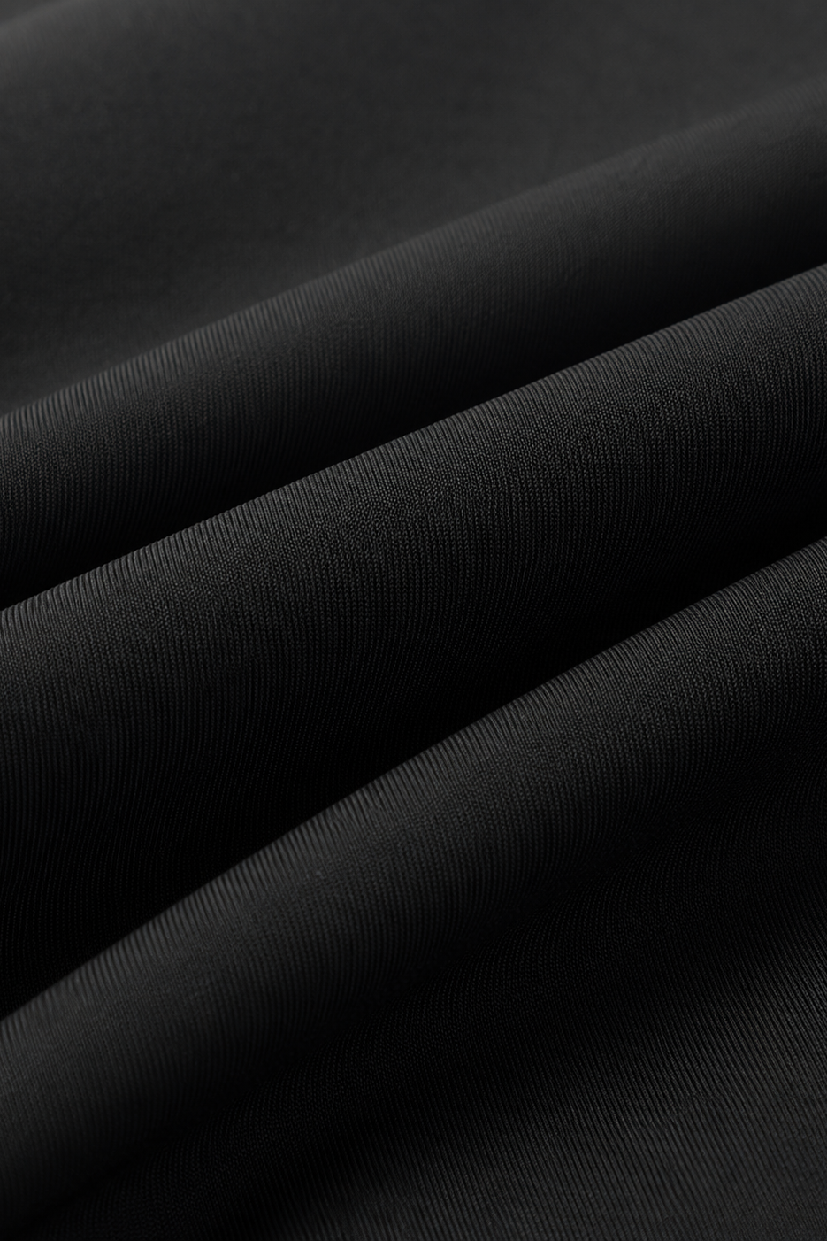 Close-up of black fabric with folds