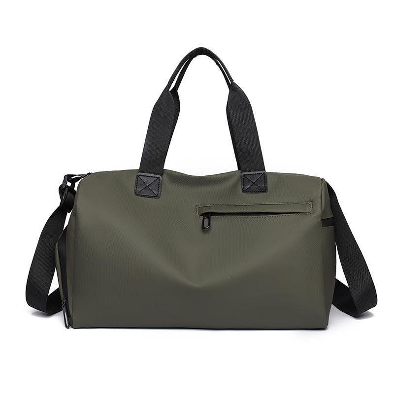Green duffel bag with black straps on a white background
