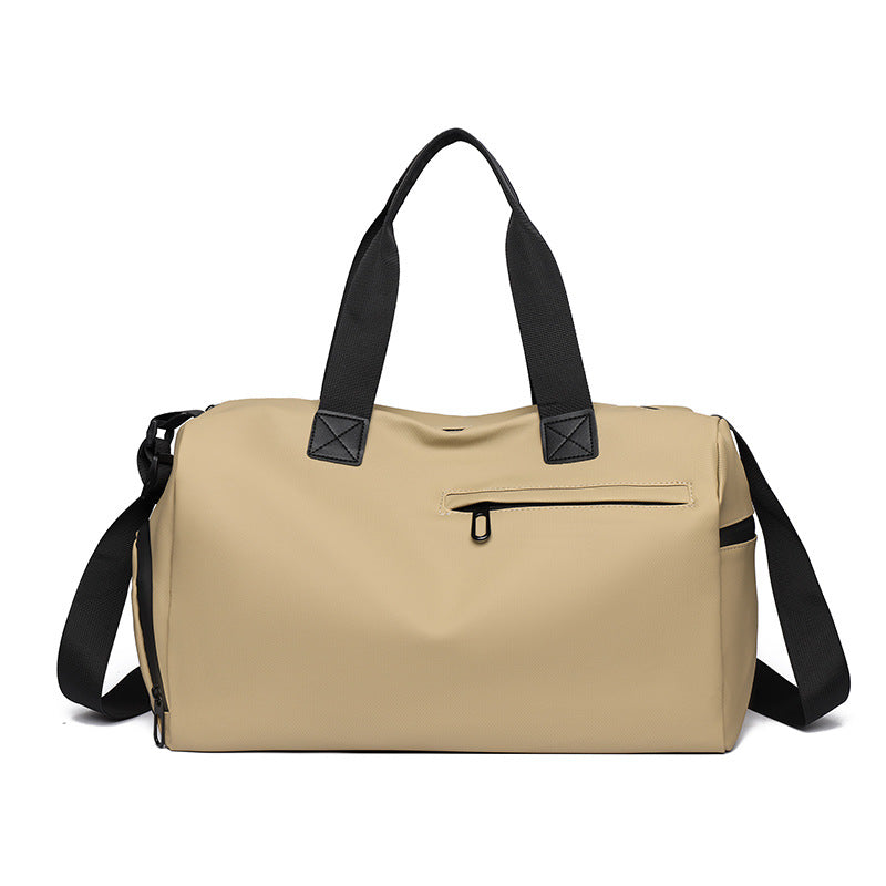 Beige duffel bag with black straps and zippers on a white background
