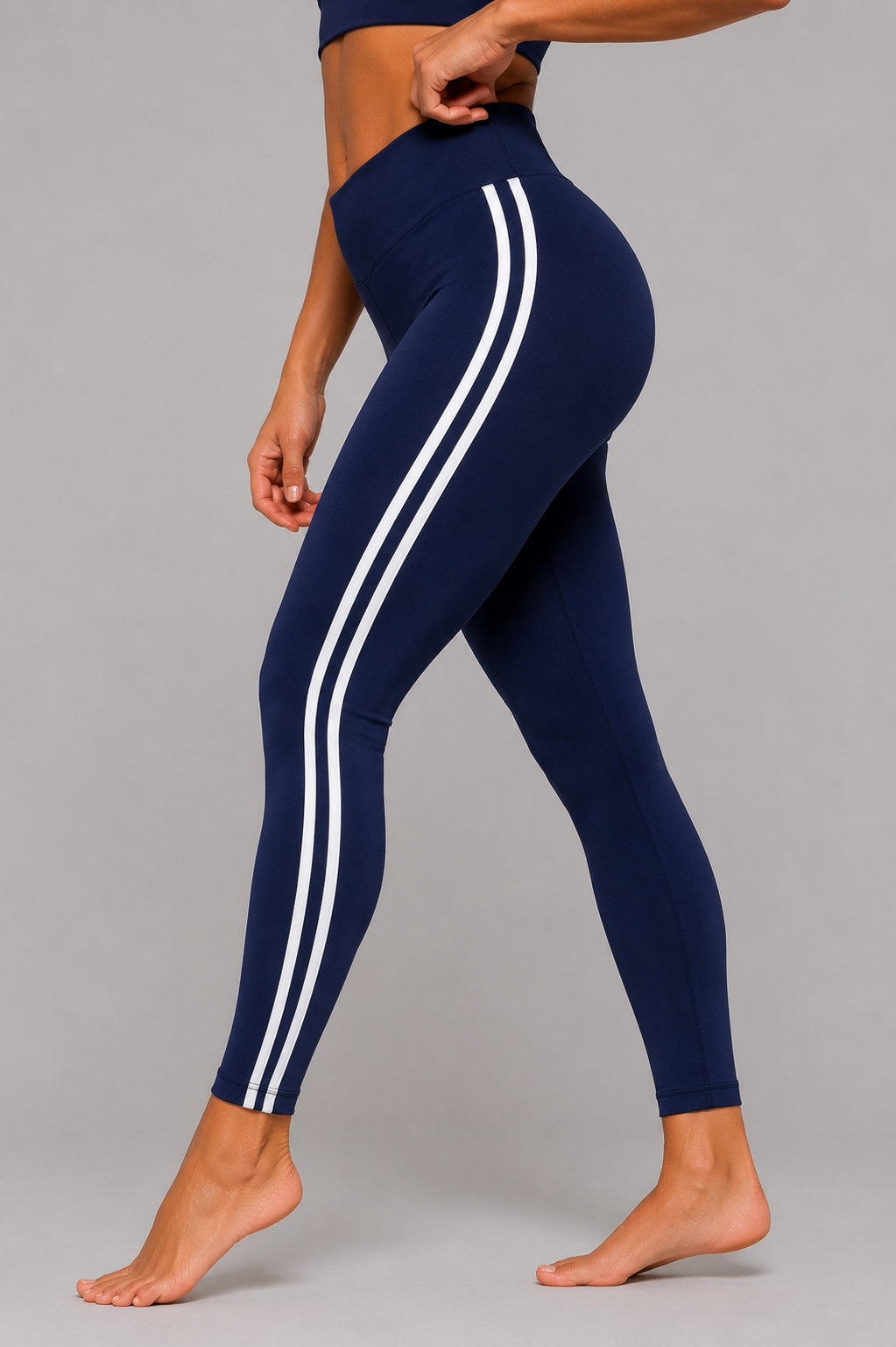 Navy leggings with white stripes on a gray background