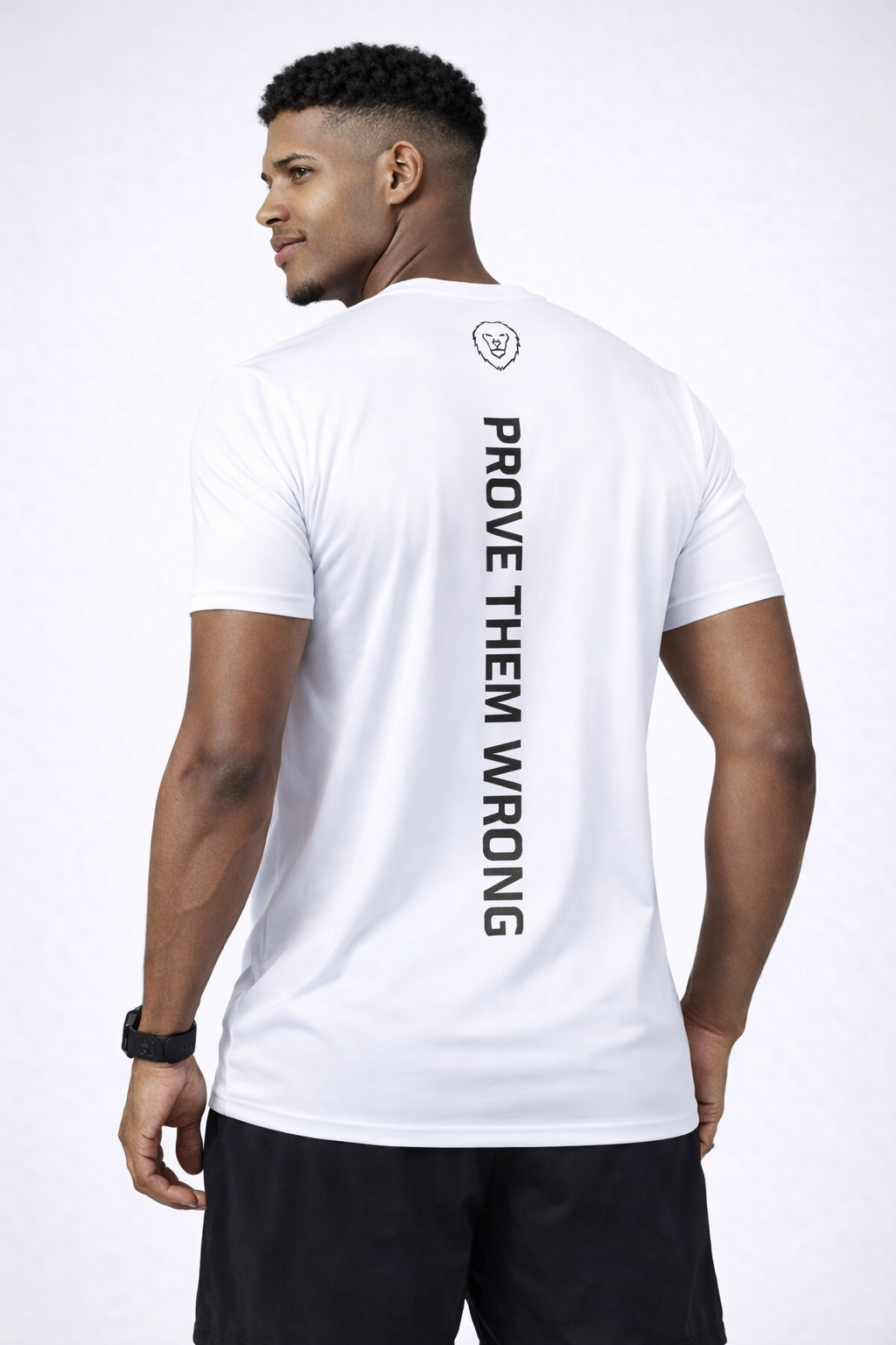 Man wearing a white t-shirt with 'PROVE THEM WRONG' text on the back against a white background