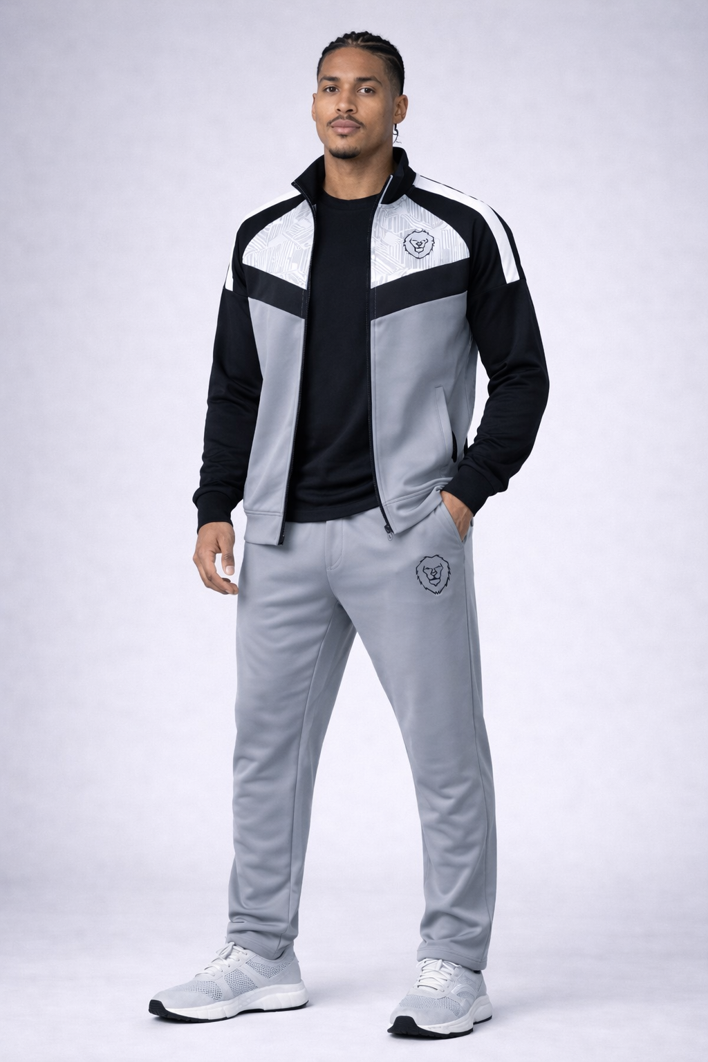 Person wearing a black, gray, and white tracksuit on a white background. Men's Tracksuit - SNO